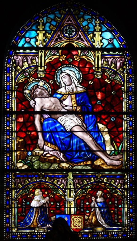 This lovely stained glass window of the Pieta is not original, but a much later addition.
