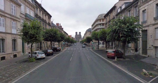 Reims cathedral from the other end of Rue Limbirgier